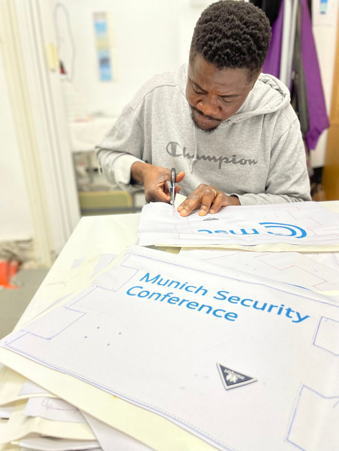 a mimycri worker preparing a bag