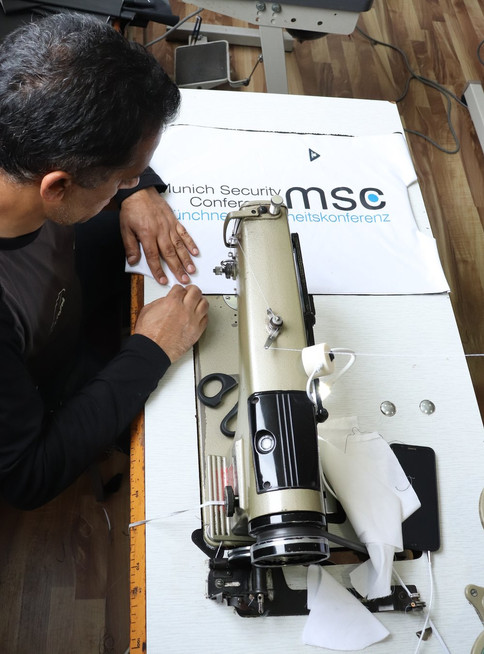 a mimycri worker preparing a bag